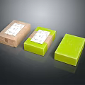 Three Piece Decorative Ornament Set Featuring Brown Green Packaged and Green Unpackaged Labeled Pieces