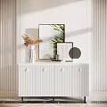 White Entryway Cabinet Sideboard With Vertical Striped Design Decorative Vase Dried Flowers And Wall Art
