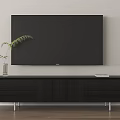 Modern Black TV Stand With Vase Green Plant And Tablet On Light Wall Wooden Floor