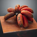 Bunch of Fresh Red and Yellow Bananas on Wooden Cutting Board