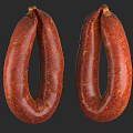 Two Ring Shaped Reddish Brown Sausages With Textured Surface On Black Background 3d model