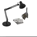 Black Desk Lamp With Adjustable Arm Bright Light Cat Figurine Open Book And Notebook
