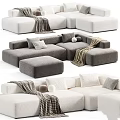 Modern Sectional Sofa Set With Grey White Upholstery Pillows Blankets And Ottoman