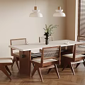 Modern Dining Room With Wooden Table Woven Back Chairs Pendant Lights And Green Plant