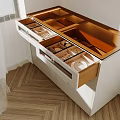 White Cabinet With Open Drawers And Divided Storage For Utensils On Herringbone Floor