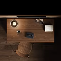 Wooden Desk Setup With Table Lamp Books Chair And Framed Artwork By Window With Blinds