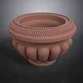 Brown Terracotta Decorative Pot With Textured Rim And Ornate Base Design