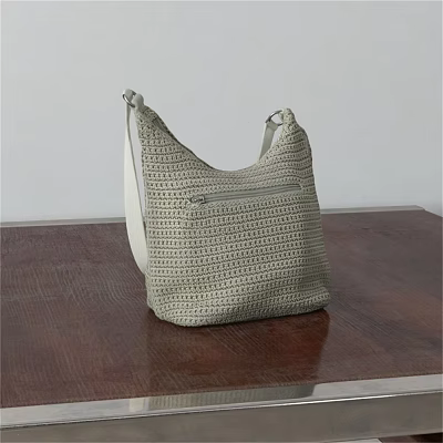 Stylish Woven Shoulder Bag With White Strap And Zipper Pocket On Wooden Tabletop 3d model