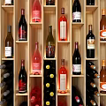 Modern Wooden Wine Cabinet With Multiple Wine Bottles And Ceiling Lights