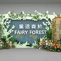 Fairy Forest Themed Stage With Green Plants Floral Decorations And Birdcage