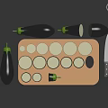 Whole and Halved Eggplants with Sliced Rounds on Wooden Cutting Board and Knife