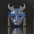 Intricate Silver Mask With Blue Enamel Patterns And Tassel Decorations