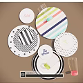 Colorful Dinnerware Set With Striped Polka Dot Plates And Clear Glasses For Table Setting