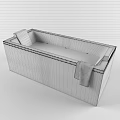 White Rectangular Bathtub With Light Blue Marbled Water Black Cushions And Grey Towel
