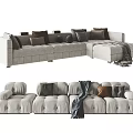 Light Colored Upholstered Sectional Sofa With Multiple Cushions And Throw Blanket 3d model