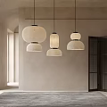 Modern Interior With Multiple Beige Fabric Pendant Lights Slatted Doors And Natural Light