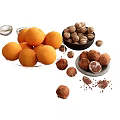 Fresh Oranges Walnuts And Chocolate Truffles On White Display Platters