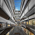 Modern Shopping Mall Atrium with Multi Level Design Glass Skylight Escalators and Shoppers