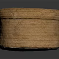 Round Brown Woven Ottoman with Handwoven Texture for Living Room Seating