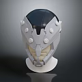 Futuristic Gray And Black Helmet With Circular Details On Display Stand