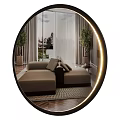 Illuminated Circular Mirror Reflects Modern Living Room With Sofa And Bookshelves