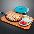 Delicious Sliced Chicken In Black Frying Pan With Side Dishes And Sauces On Wooden Tray