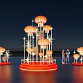 Lantern Shaped Art Installation With Orange Lanterns Red Base And Radiant Decorations In Night Sky