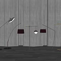 Modern Curved Floor Lamps With Black And Metallic Shades Against Gray Wall And Wooden Floor
