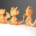 Three Cute Orange Baby Dragons Flying Animal Toys With Wings Displayed
