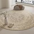 Natural Woven Round Rug in Bright Room with White Vase Greenery and Small Basket
