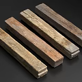 Five Natural Stone Wood Elongated Pieces With Various Colors And Textures On Dark Background
