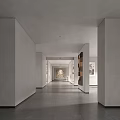 Modern Elevator Hallway With White Walls Gray Floor Columns And Decorative Artworks