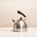 Stainless Steel Kettle With Black Handle As Modern Daily Use Household Appliance