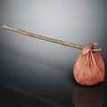 Long Wooden Stick With Hanging Red Fabric Bag On Dark Reflective Surface