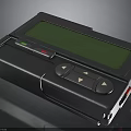 Handheld Black Electronic Device With Green Screen And Control Buttons