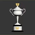 Silver Trophy Featuring Golden Top Decoration And Black Base With Golden Emblem