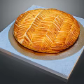 Delicious Golden Round Braided Puff Pastry on Light Blue Square Platter and Gold Base Plate