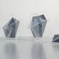Modern Geometric Sculptures With Metal Frames And Transparent Panels On Smooth Surface
