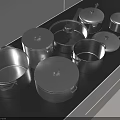 Various Sizes And Shapes Of Cookware Including Lidded Pots And Pans On Black Countertop