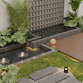 Layered Water Fountain with Lush Greenery Wooden Deck and Path Lights