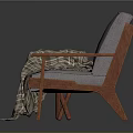 Gray Cushioned Chair With Wooden Armrests Plaid Blanket And Cross Legged Side Table With Books