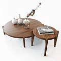 Modern Round Walnut Wood Coffee Table With White Vases Dried Branches And Books
