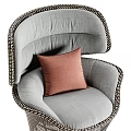Modern Wicker Leisure Chair with Light Gray Cushion and Pink Pillow