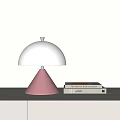 Modern Table Lamp With White Dome Lampshade And Pink Cone Base By Stacked Books