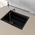 Modern Black Kitchen Sink With Faucet On Light Colored Countertop Surface