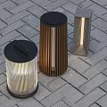 Modern Outdoor Lights With Various Designs And Warm Glow On Brick Pavement