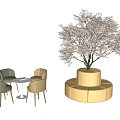 Two Colored Chairs With Small Round Table And Blooming Tree On Circular White Platform