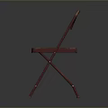 Vintage Red Folding Chair With Worn Metal Frame And Simple Background