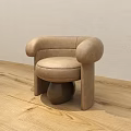 Beige Modern Single Seater Sofa With Rounded Armrests And Ball Shaped Legs On Wooden Floor