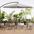 Modern Outdoor Table Setup With Curved Umbrella Chairs And Green Plants On Wooden Deck